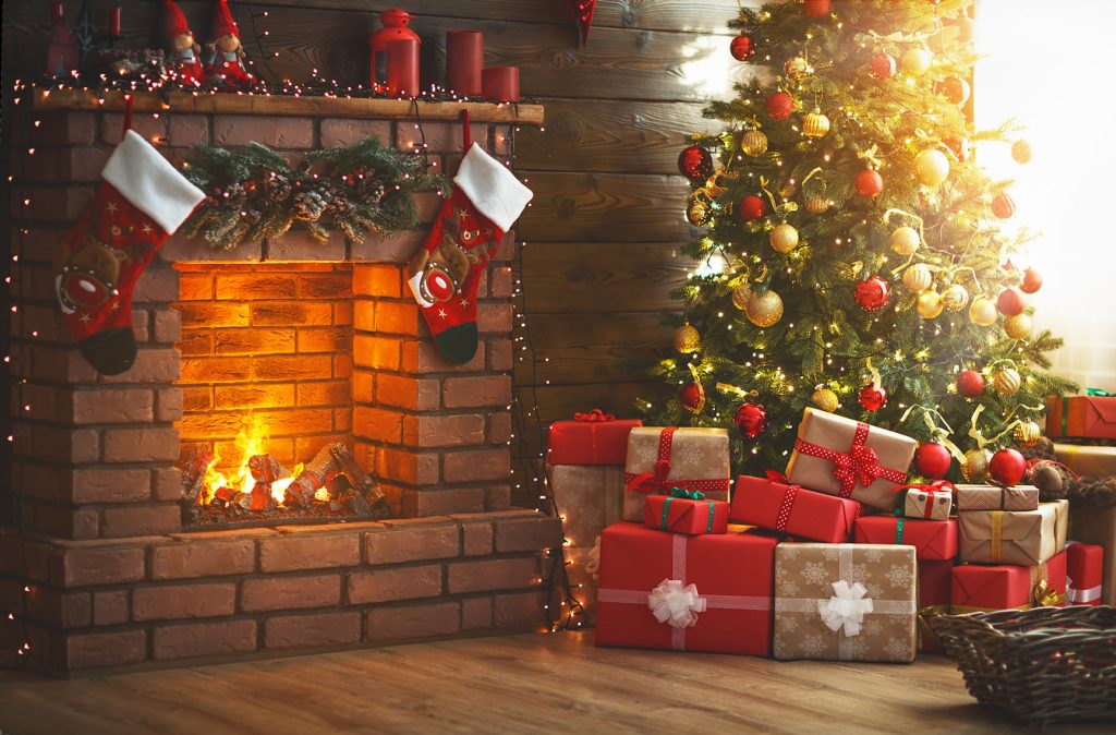 Christmas tree and lit fireplace